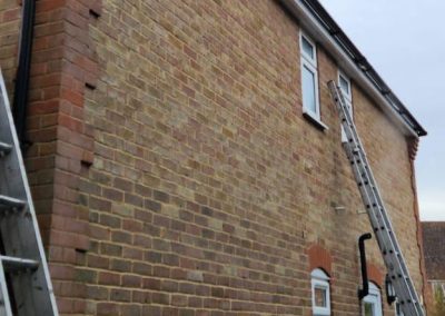 claygate roofing and guttering ladder on house